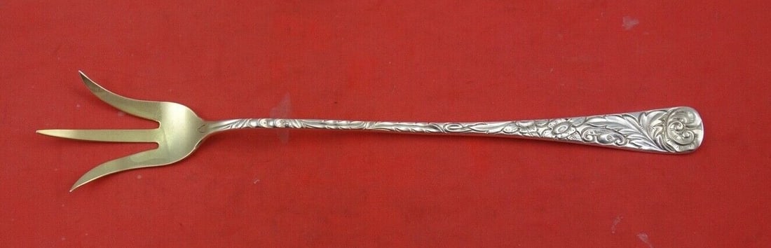 Durgin Scroll Sterling Silver Lettuce Fork Gold Wash 7 7/8": Durgin Scroll Sterling Silver Lettuce Fork Gold Wash 7 7/8" This exquisite serving fork, crafted by Durgin, features a beautiful 'Scroll' pattern. Made from high-quality sterling silver, this lettuce 