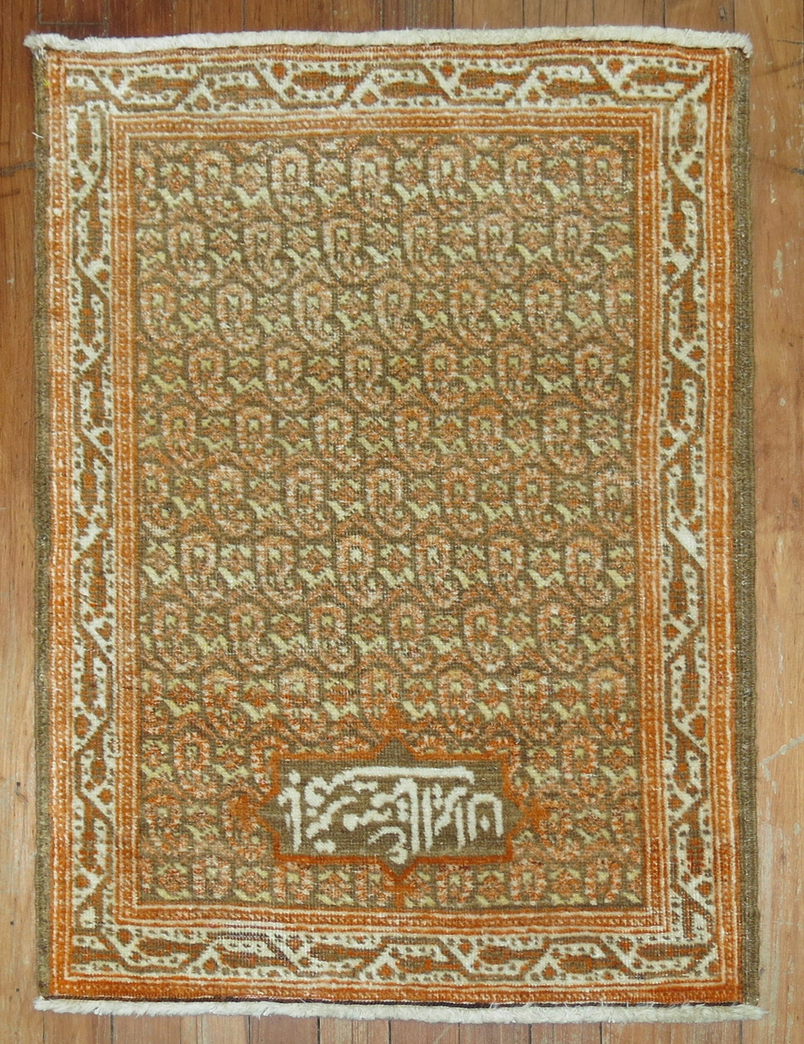 1' 11" x 2' 6" Persian Tabriz Yastik Rug Signed: 1' 11" x 2' 6" Persian Tabriz Yastik Rug Signed Signed Persian Tabriz mat in brown and orange. This pre-owned piece is identified as a Tabriz yastik and is signed by the weaver. Specifications Type: T