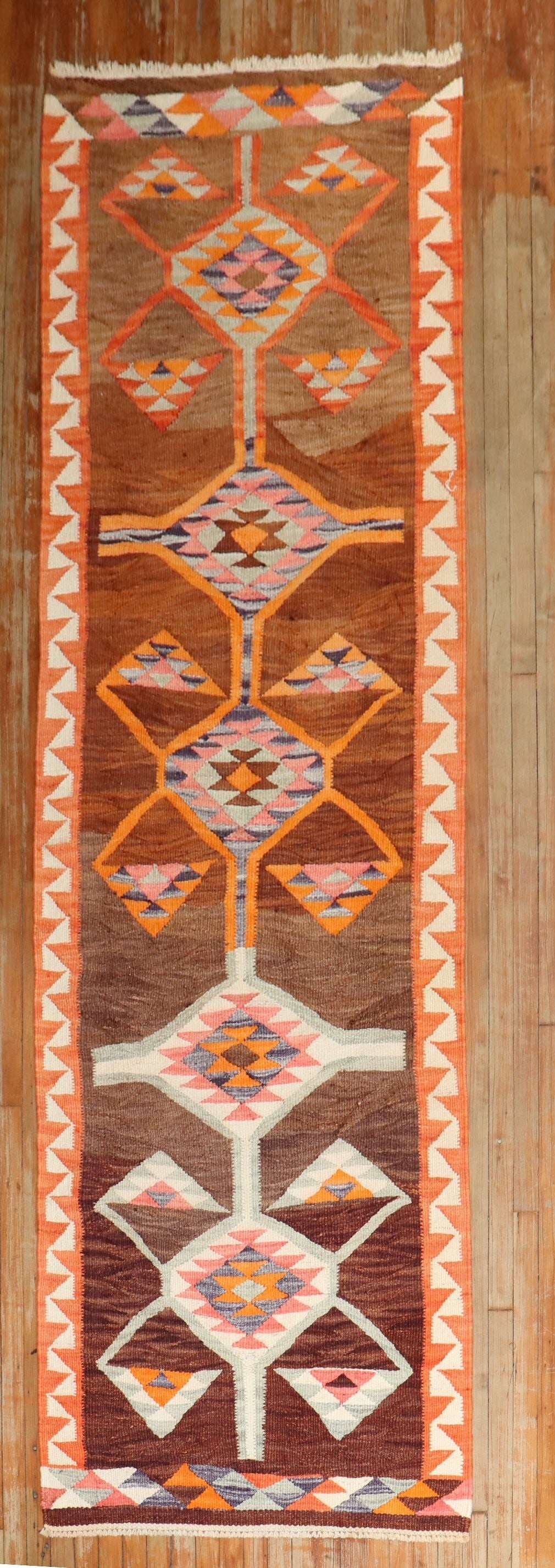 3' 5" x 11' 8" Turkish Kilim runner with geometric motif: 3' 5" x 11' 8" Turkish Kilim runner with geometric motif Mid-20th century Turkish kilim runner with a geometric design. This pre-owned wide runner features a decorative woven pattern and retains the c