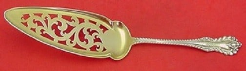Dominick and Haff Mazarin Sterling Silver Jelly Server Goldwashed Pierced 9 5/8: Dominick and Haff Mazarin Sterling Silver Jelly Server Goldwashed Pierced 9 5/8 Sterling silver jelly cake server in the Mazarin pattern by Dominick & Haff. It features a goldwashed pierced blade, is 