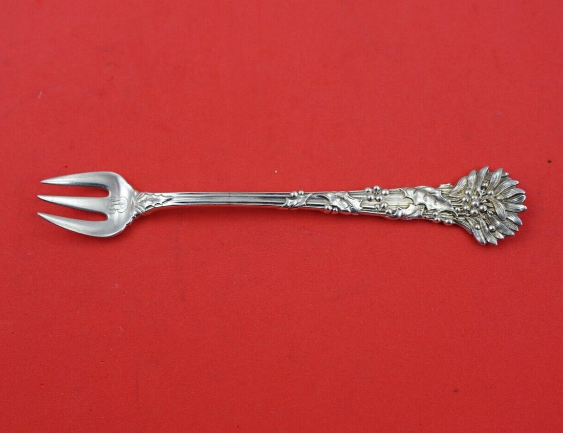 Tiffany & Co Holly Sterling Silver Cocktail Fork 5 3/4 Inch: Tiffany & Co Holly Sterling Silver Cocktail Fork 5 3/4 Inch This exquisite cocktail fork is part of the 'Holly' pattern by Tiffany & Co., crafted from high-quality sterling silver. Measuring 5 3/4 inc