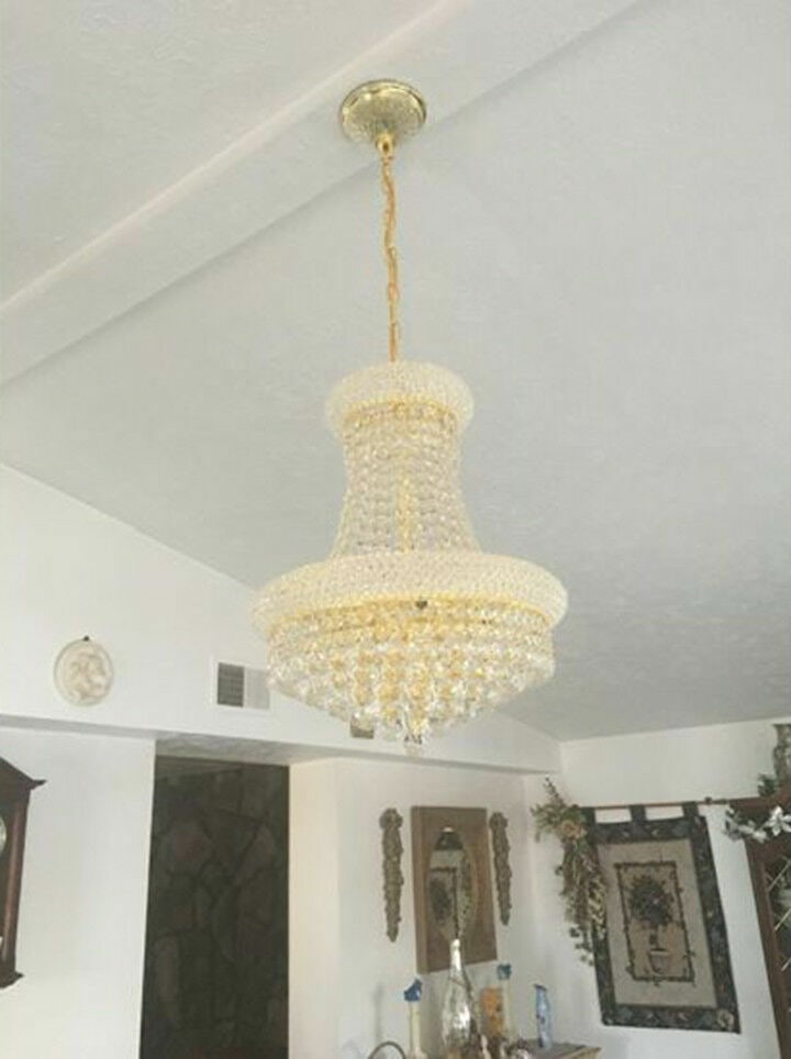 Primo 8 Light Gold Crystal Empire Chandelier 16 inch by 20 inch: Primo 8 Light Gold Crystal Empire Chandelier 16 inch by 20 inch This modern empire-style chandelier features a large gold frame adorned with Royal Cut clear crystals, offering a sophisticated lighting