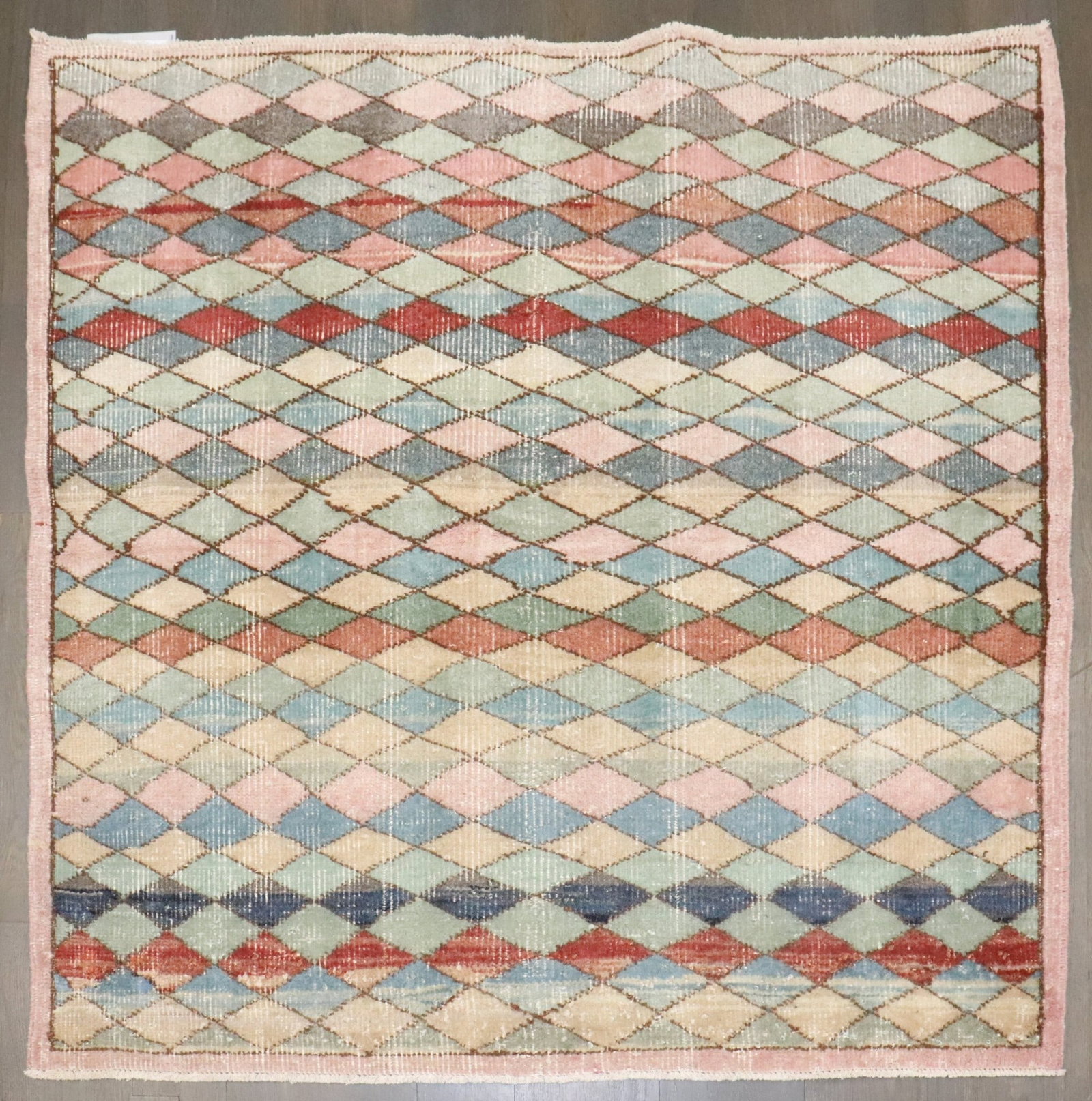 3' 11" x 4' 2" Mid 20th Century Turkish Square Deco Rug: 3' 11" x 4' 2" Mid 20th Century Turkish Square Deco Rug Mid-20th century Turkish Deco square rug with a compact format suited to a variety of interiors. This pre-owned piece features a Deco design and