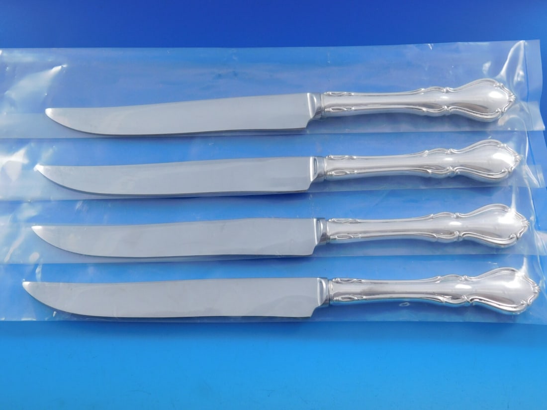 Reed and Barton Hampton Court Sterling Silver Steak Knife Set 4pc Texas Size: Reed and Barton Hampton Court Sterling Silver Steak Knife Set 4pc Texas Size Introducing the Hampton Court Steak Knife Set by Reed and Barton, a striking 4-piece collection crafted from high-quality s