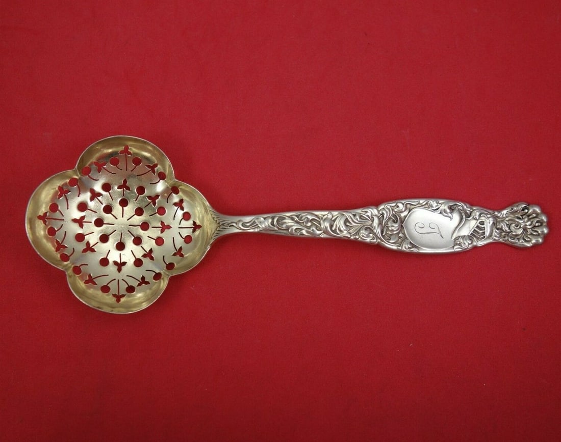 Whiting Heraldic Sterling Silver Sugar Sifter Gold Washed 6 3/4": Whiting Heraldic Sterling Silver Sugar Sifter Gold Washed 6 3/4" This exquisite sugar sifter from the Heraldic pattern by Whiting dates back to 1850-1899, showcasing a beautiful design featuring a thr