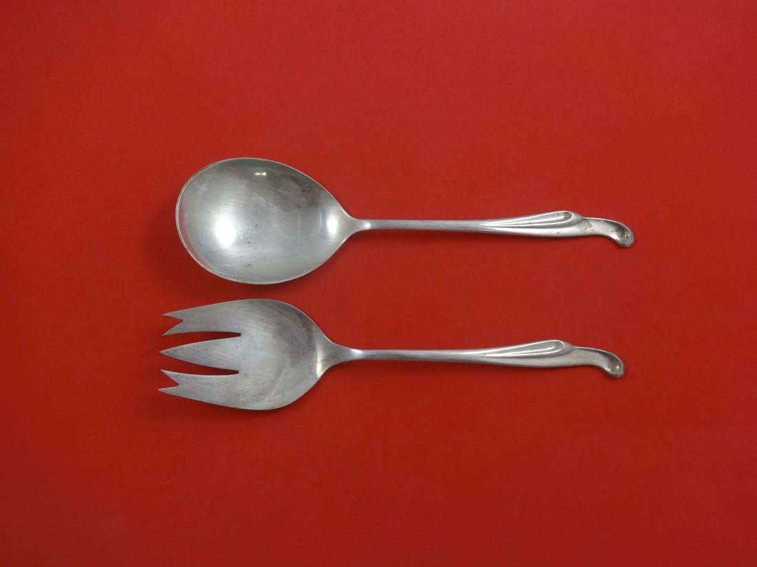 Stieff Silver Surf Sterling Silver 2-Piece Salad Serving Set: Stieff Silver Surf Sterling Silver 2-Piece Salad Serving Set Enhance your dining experience with the Silver Surf by Stieff Sterling Silver Salad Serving Set. This exquisite 2-piece set includes an 8 5