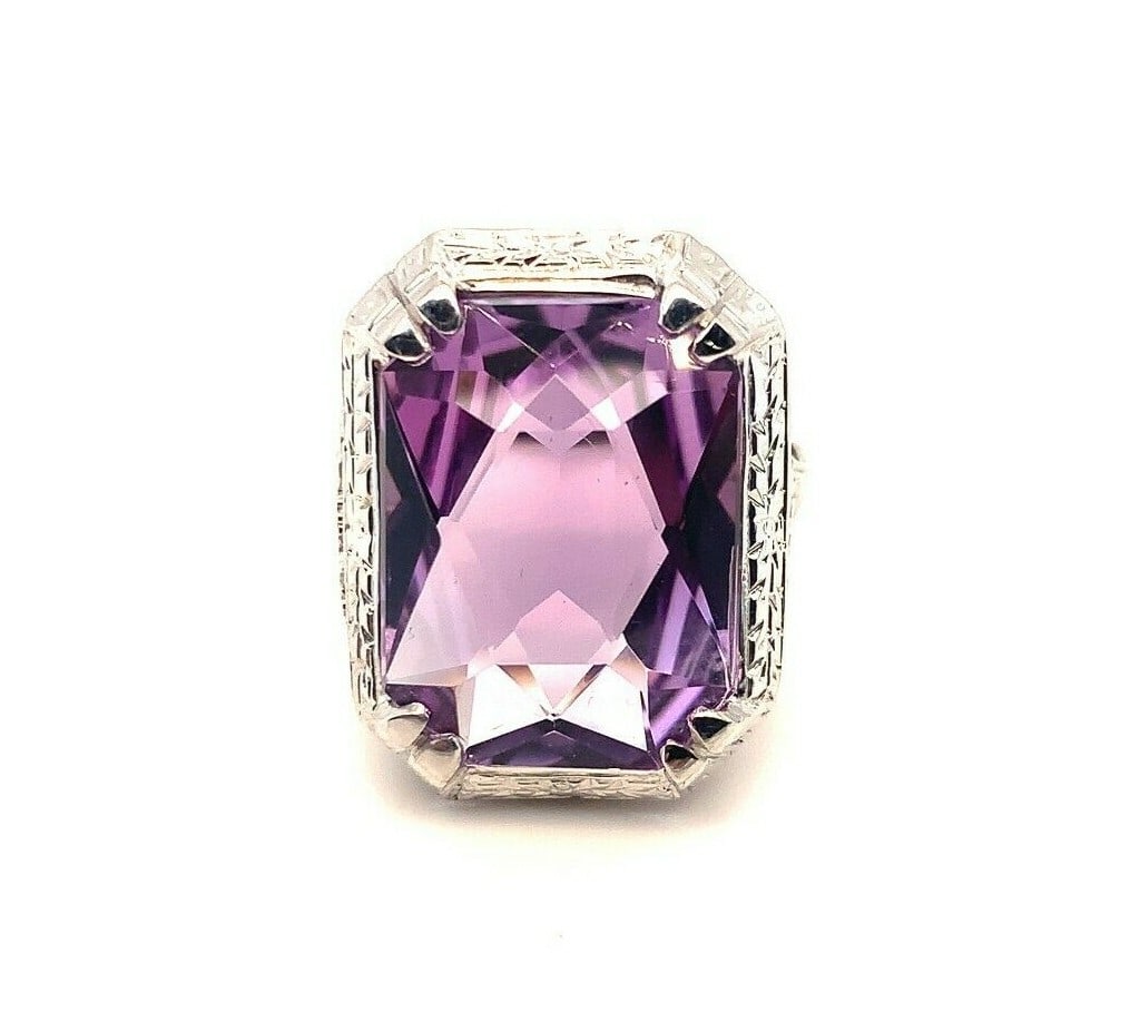 Art Deco 18k White Gold Filigree 9.09ct Amethyst Ring GIA Certified: Art Deco 18k White Gold Filigree 9.09ct Amethyst Ring GIA Certified This exquisite Art Deco ring showcases an impressive 9.09 carat genuine natural amethyst, elegantly set in 18k white gold filigree. 