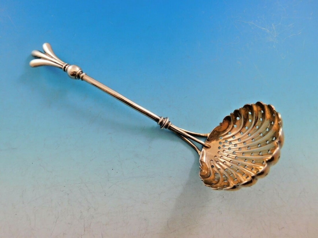 Antique Art Silver Sterling Sugar Sifter 1860-1883 5 3/4 inch Pierced Handle: Antique Art Silver Sterling Sugar Sifter 1860-1883 5 3/4 inch Pierced Handle This exquisite sterling silver sugar sifter, dating from the Art Silver period of 1860-1883, is a remarkable serving piece 