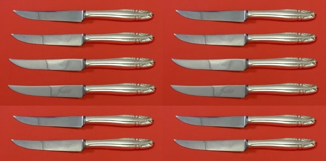 Wallace Stradivari Sterling Silver Steak Knife Set of 12: Wallace Stradivari Sterling Silver Steak Knife Set of 12 This exquisite custom set of 12 steak knives features the elegant Stradivari pattern by Wallace. Each knife is crafted with a hollow sterling s