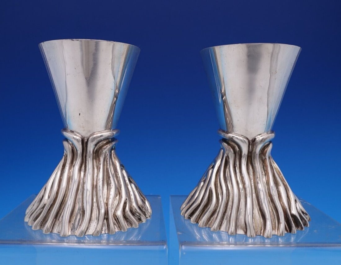 Pair of Tane sterling silver candlesticks from Mexico Mid-Century: Pair of Tane sterling silver candlesticks from Mexico Mid-Century A pair of Tane Mexican sterling silver candlesticks in a Mid-Century Modern style. Made in Mexico, the pieces are in good pre-owned es