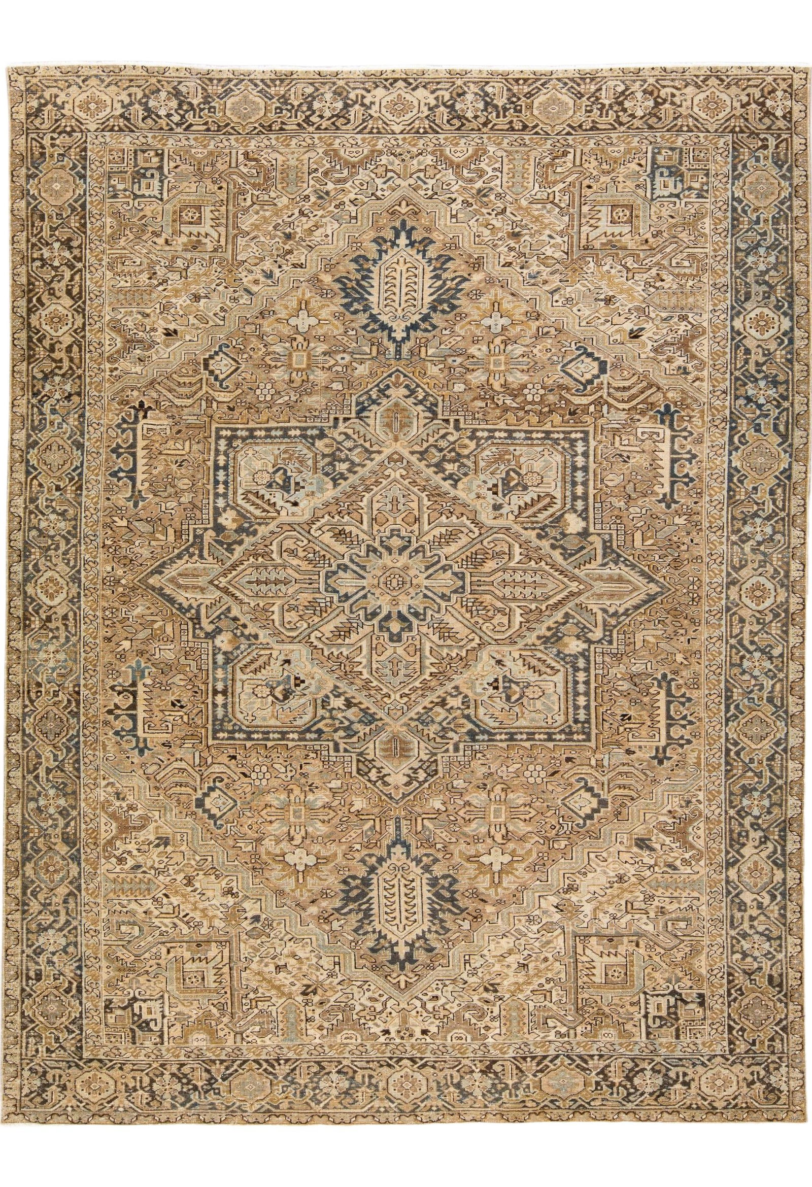 Antique Heriz Handmade Wool Rug Beige Blue Geometric 10'7" x 14'1": Antique Heriz Handmade Wool Rug Beige Blue Geometric 10'7" x 14'1" This exquisite antique Heriz rug features a hand-knotted wool construction with a stunning beige field complemented by a blue frame a