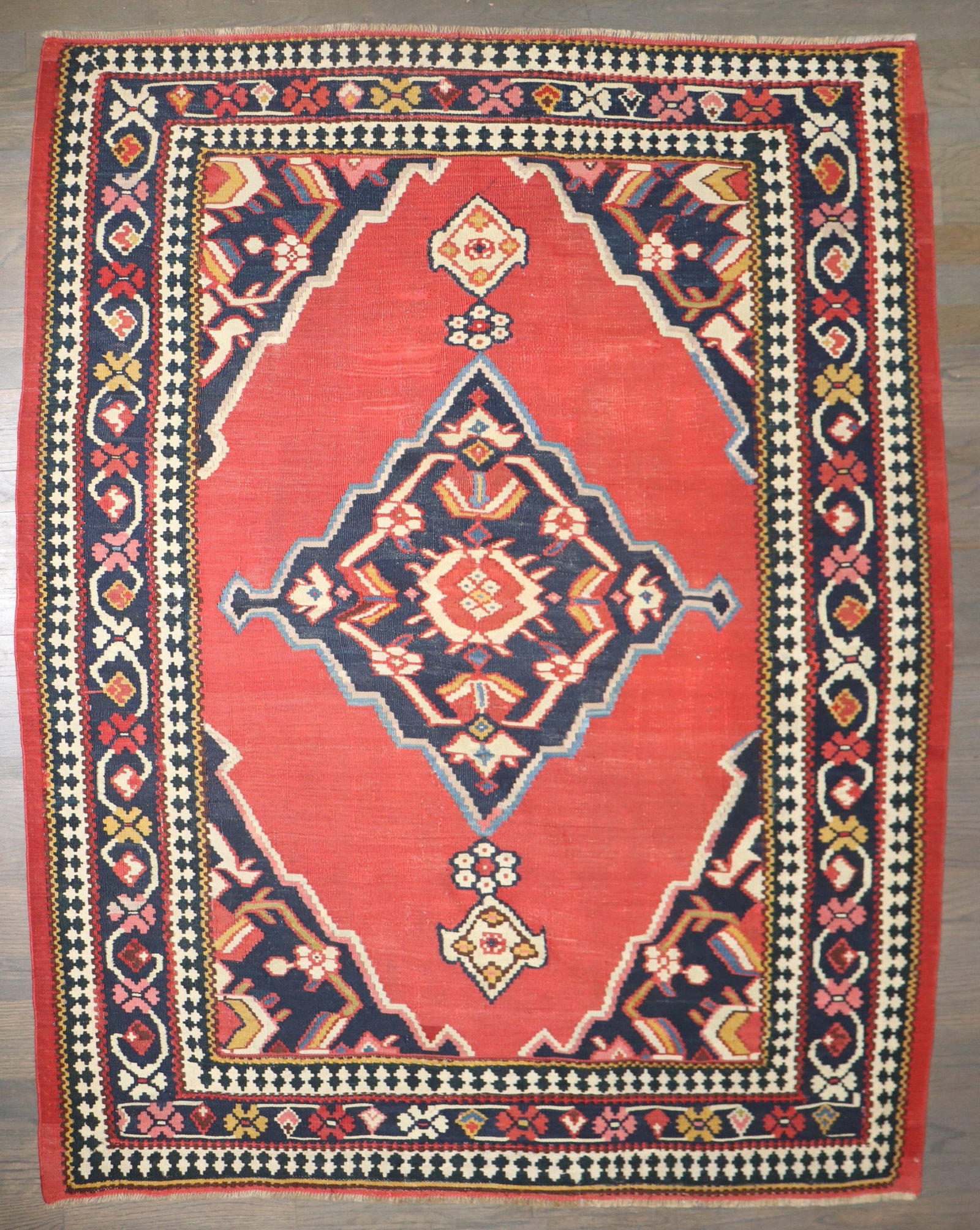 4' x 5' 6" Persian Senneh Kilim Rug Red and Blue: 4' x 5' 6" Persian Senneh Kilim Rug Red and Blue Late 19th century Persian Senneh kilim with a finely woven construction and jewel-toned red and blue palette. This antique small-format rug is presente