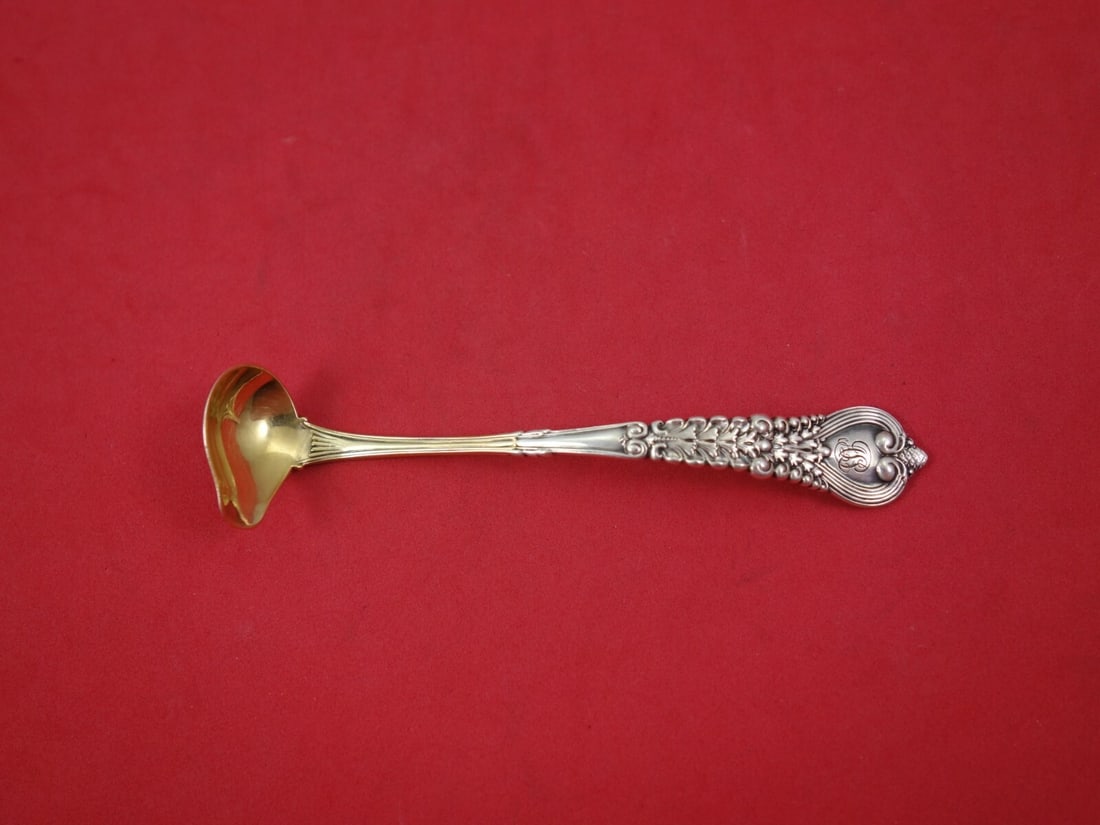 Tiffany & Co Florentine Sterling Silver Mustard Ladle Gold Wash 4 7/8 in: Tiffany & Co Florentine Sterling Silver Mustard Ladle Gold Wash 4 7/8 in This exquisite mustard ladle from the renowned Florentine pattern by Tiffany & Co. is a stunning addition to any sterling silve