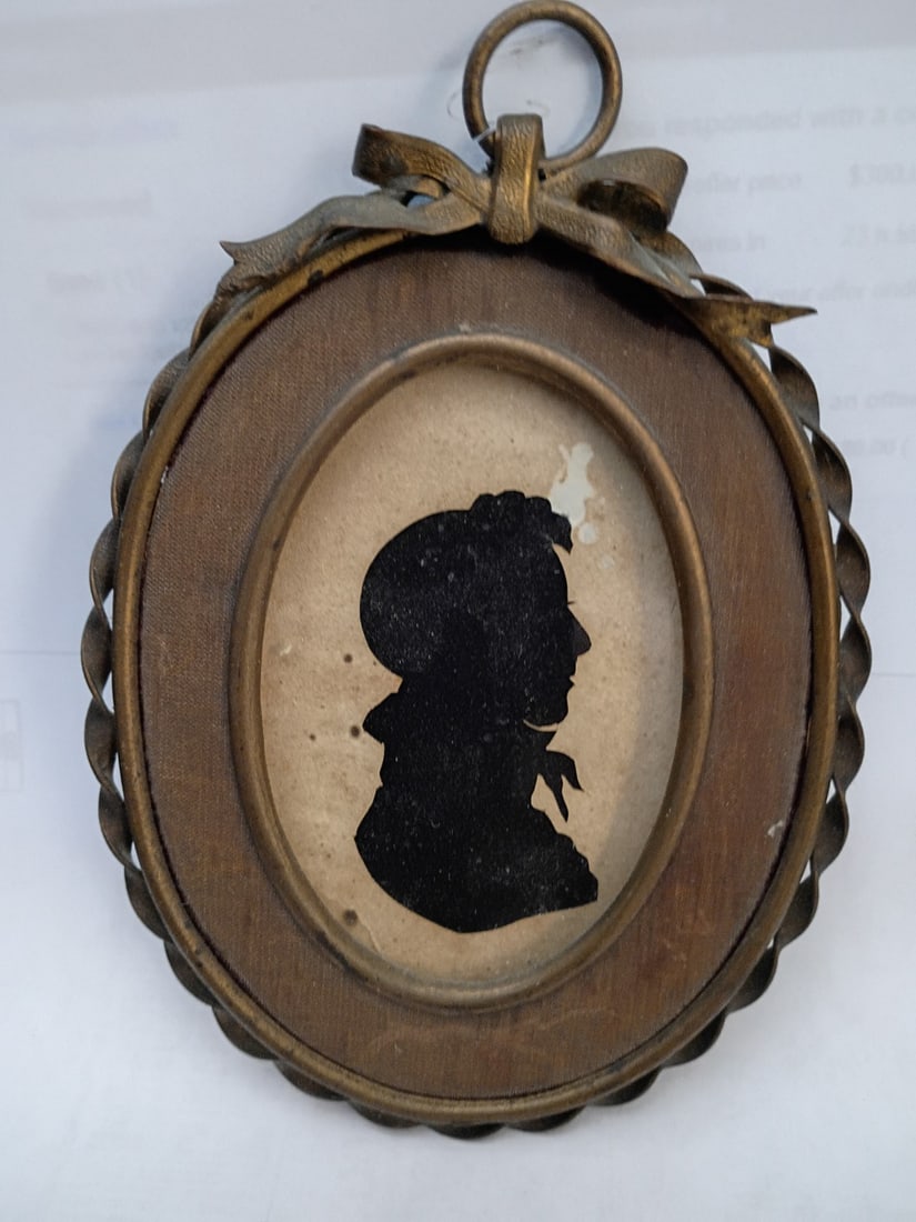 Oval paper cut silhouette in brass French frame 5.5 in: Oval paper cut silhouette in brass French frame 5.5 in Antique hand-cut paper silhouette presented in an oval brass French frame. This original 19th-century piece is described as pre-owned and offers 