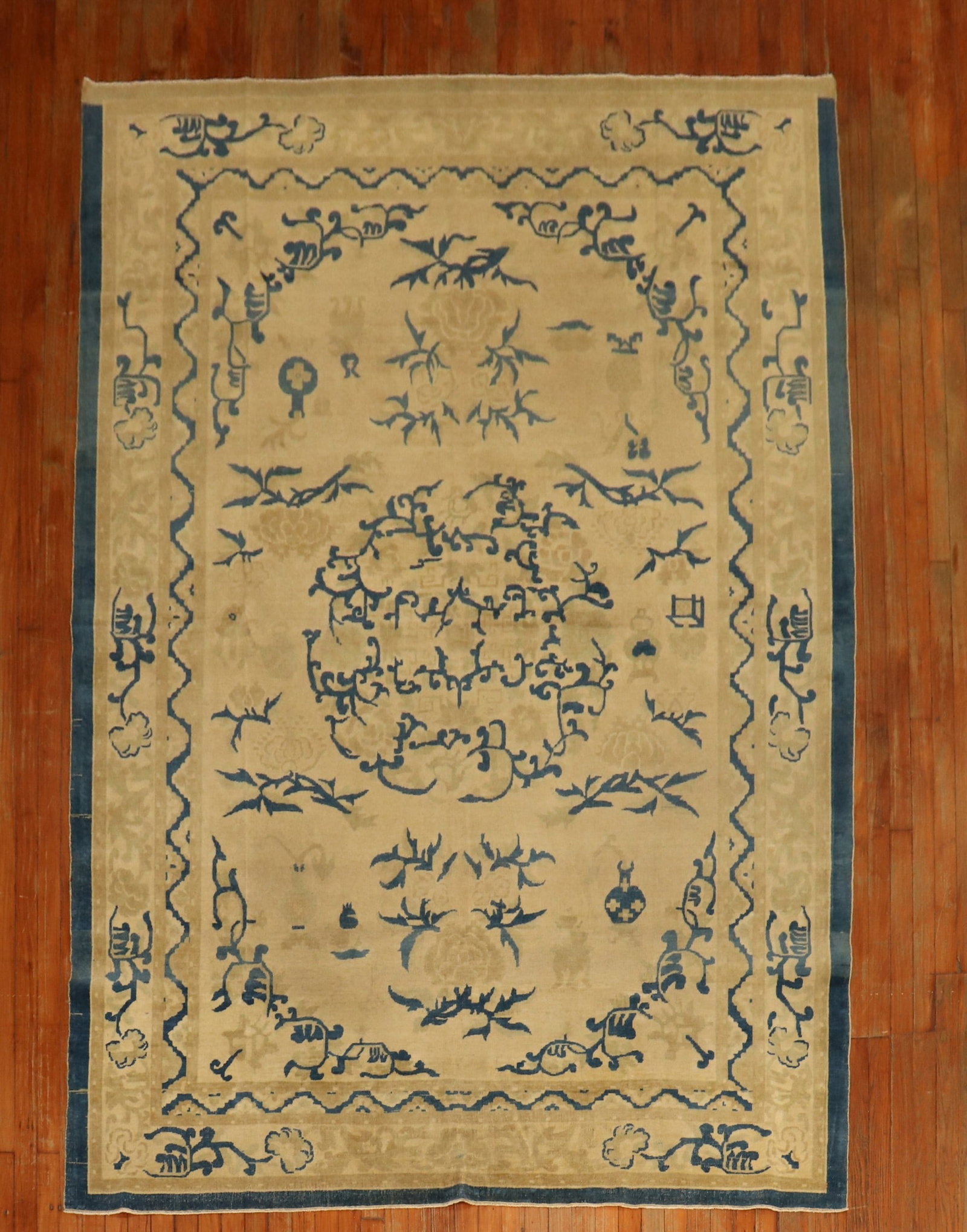 6' 6" x 9' 5" Antique Chinese Rug Beige and Blue circa 1880: 6' 6" x 9' 5" Antique Chinese Rug Beige and Blue circa 1880 Antique Chinese rug from the 19th century with a fine weave and a decorative design. It features a beige oval-shaped field accented in denim