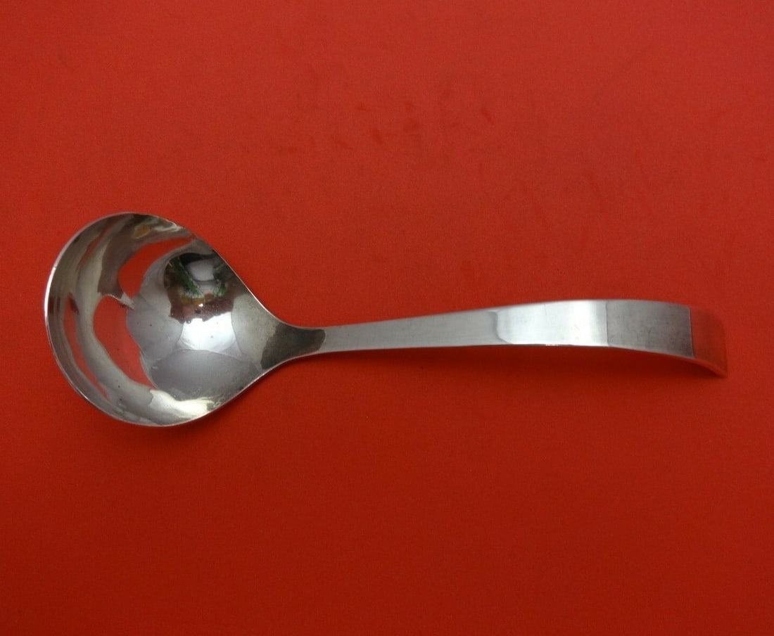 Adra Moderne Sterling Silver Gravy Ladle 6.25 Inch Serving Piece: Adra Moderne Sterling Silver Gravy Ladle 6.25 Inch Serving Piece This exquisite 6 1/4" gravy ladle is part of the Moderne pattern by Adra, crafted from high-quality sterling silver. It features a slee
