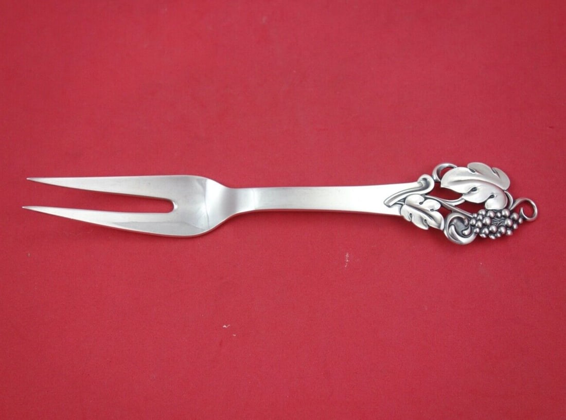 Cohr Sterling Silver 2-Tine Cold Meat Fork Grapes 8.5": Cohr Sterling Silver 2-Tine Cold Meat Fork Grapes 8.5" This exquisite Cohr Sterling Silver Cold Meat Fork features a 2-tine design adorned with intricate grape motifs, measuring 8 1/2 inches in length