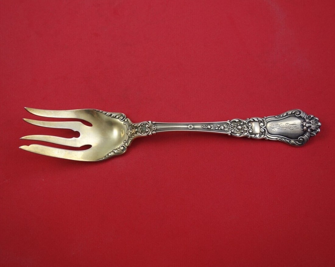 Gorham Baronial Old Sterling Silver Gold Washed Serving Fork 8.5": Gorham Baronial Old Sterling Silver Gold Washed Serving Fork 8.5" This exquisite serving fork features the classic Baronial Old pattern by Gorham, crafted from sterling silver and elegantly gold washe