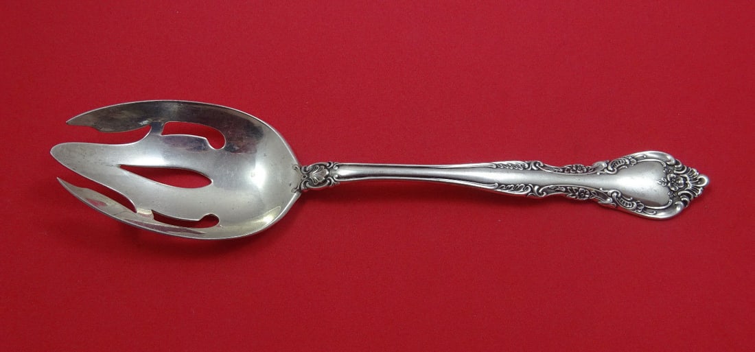 Wallace Feliciana sterling silver pierced slotted serving spoon 8 1/2": Wallace Feliciana sterling silver pierced slotted serving spoon 8 1/2" Feliciana by Wallace sterling silver pierced serving spoon, original 8 1/2 in. piece with 3-hole piercing. It is not monogrammed 