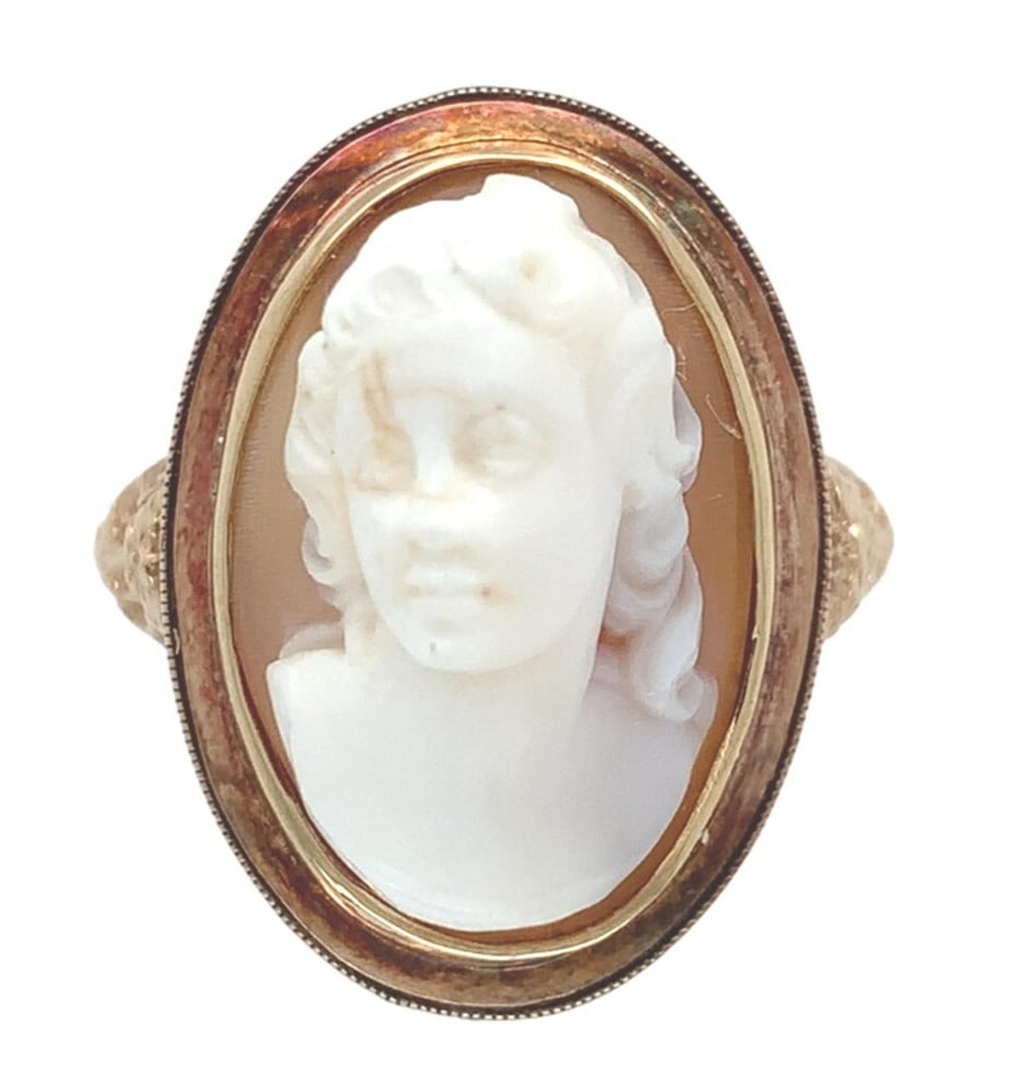 Authentic 10k Gold Filigree Ring with Natural Shell Cameo 1920s: Authentic 10k Gold Filigree Ring with Natural Shell Cameo 1920s This exquisite 10k gold filigree ring features a stunning 3-D high relief genuine natural shell cameo. The oval brown and white shell ca