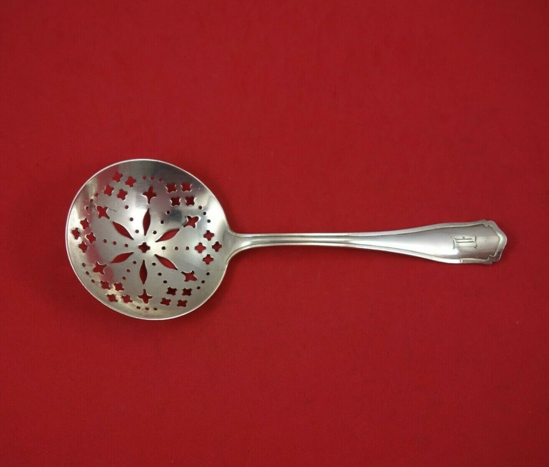 Shreve Dolores Sterling Silver 8.5" Pierced Serving Spoon: Shreve Dolores Sterling Silver 8.5" Pierced Serving Spoon Discover the exquisite Dolores by Shreve sterling silver pea spoon, measuring 8 1/2". This elegant serving spoon features a finely pierced bow