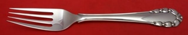 Georg Jensen Lily of the Valley Sterling Silver 4 Tine Salad Fork 6 7/8": Georg Jensen Lily of the Valley Sterling Silver 4 Tine Salad Fork 6 7/8" Sterling silver salad fork in the Lily of the Valley pattern by Georg Jensen. This 4-tine flatware piece measures 6 7/8 inches 