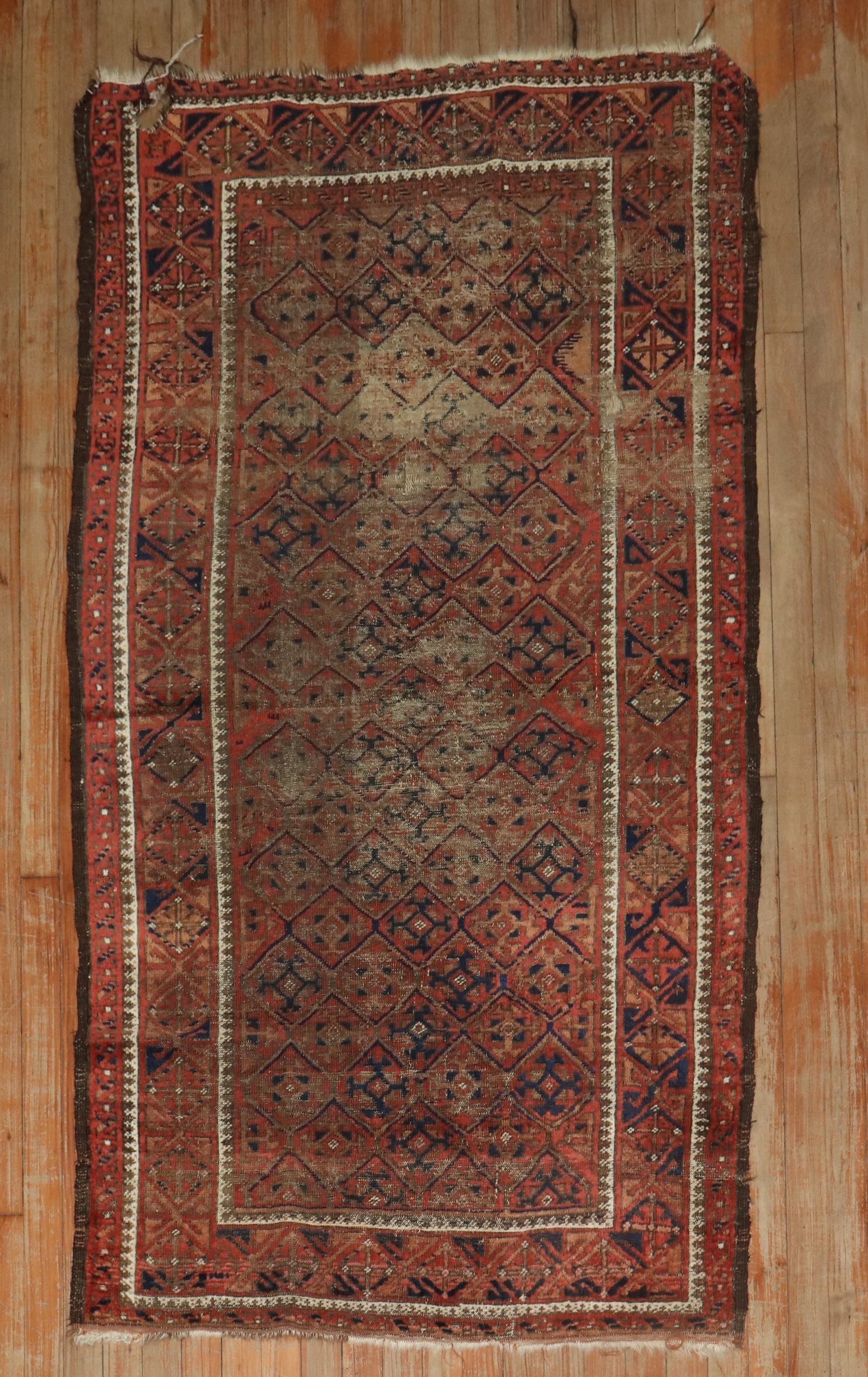 3' 4" x 6' 3" Late 19th Century Balouch Shabby Chic Rug: 3' 4" x 6' 3" Late 19th Century Balouch Shabby Chic Rug Late 19th century distressed Balouch rug with a geometric pattern. This pre-owned small rug is described as Balouch and Shabby Chic. Specificati