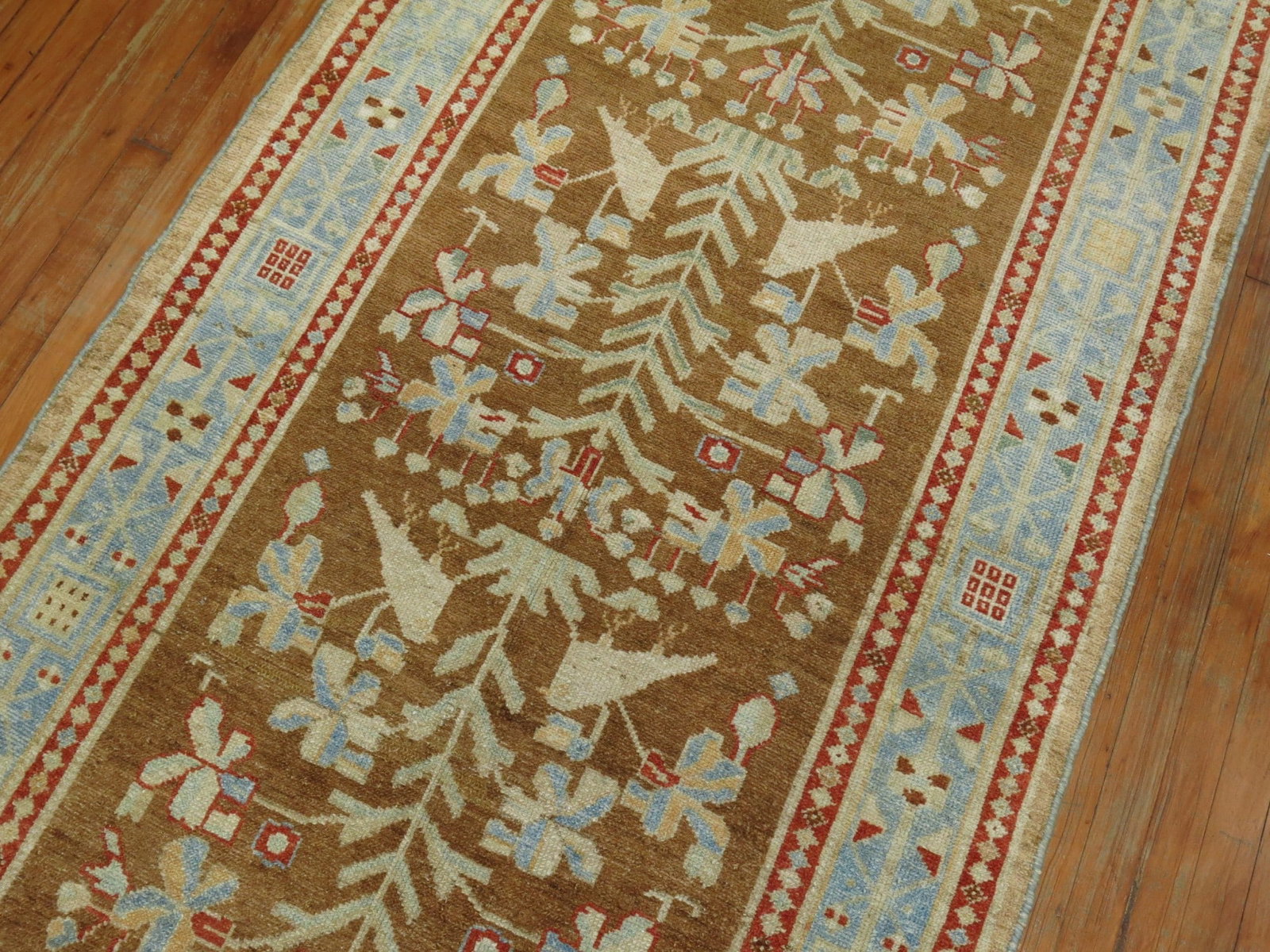 3' 10" x 15' 6" Malayer pictorial Persian runner with pigeons: 3' 10" x 15' 6" Malayer pictorial Persian runner with pigeons A pre-owned Persian Malayer pictorial runner featuring a brown and icy blue palette with pigeon motifs in the field. This wide gallery run