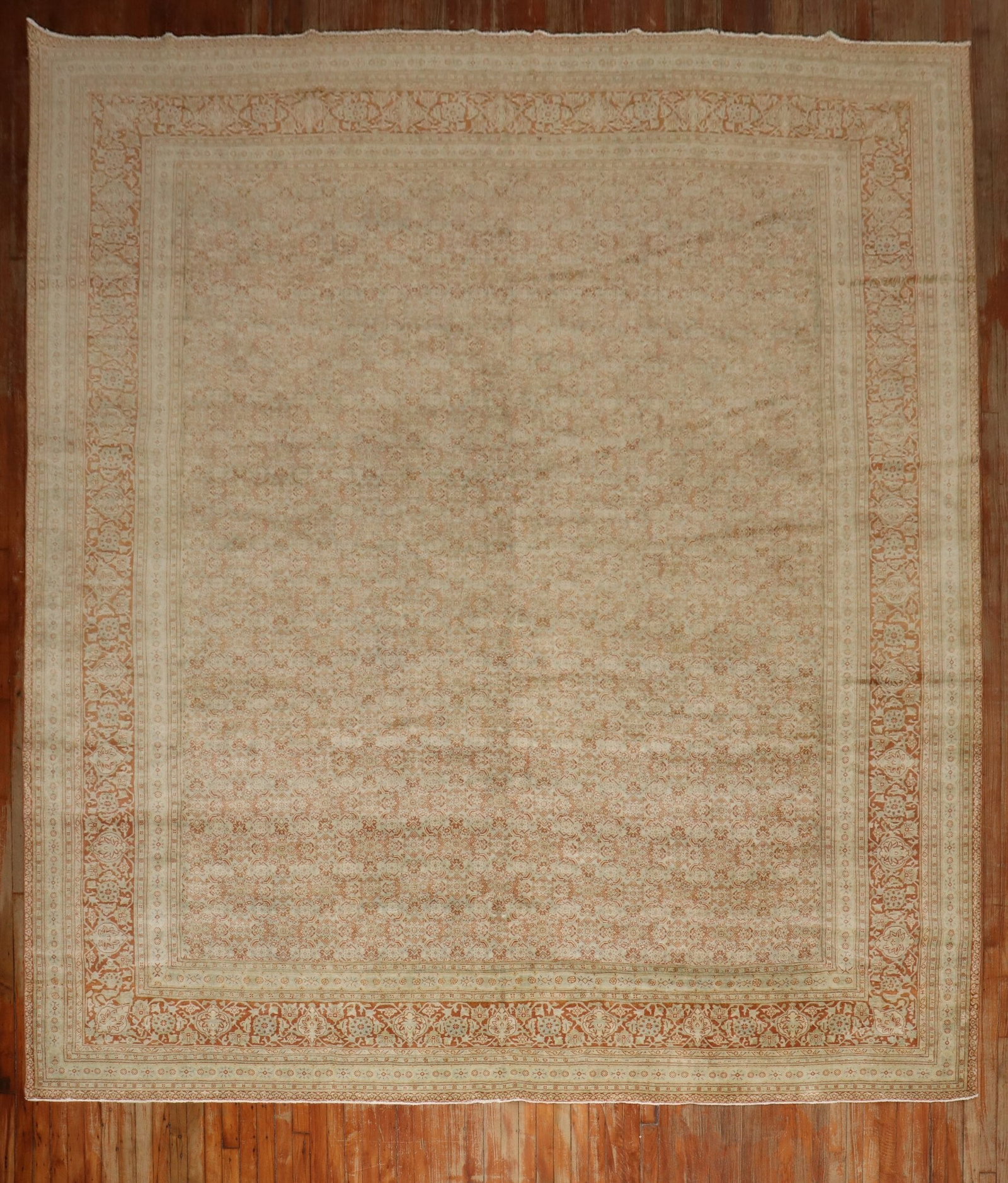 10' 6" x 12' 9" 1930s Persian Tabriz Room Rug: 10' 6" x 12' 9" 1930s Persian Tabriz Room Rug Persian Tabriz room rug from the 1930s in soft green and apricot, featuring an intricate floral pattern and decorative border. Pre-owned condition. Specif