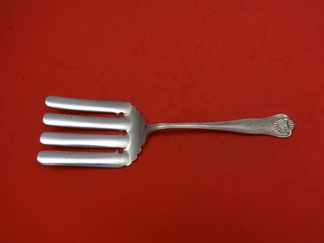 Frank Smith Newport Shell Sterling Silver Asparagus Fork 9.5": Frank Smith Newport Shell Sterling Silver Asparagus Fork 9.5" This exquisite asparagus fork features the Newport Shell pattern by Frank Smith, crafted from high-quality sterling silver. With a length 
