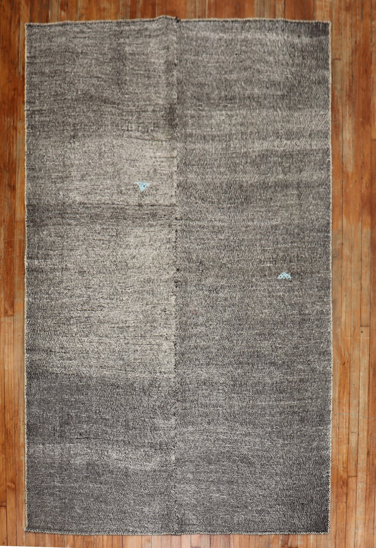5' 11" x 9' 1" Midcentury Turkish Kilim Rug Charcoal: 5' 11" x 9' 1" Midcentury Turkish Kilim Rug Charcoal Midcentury Turkish kilim with a minimalist plain design in an overall charcoal shade, accented by small light blue motifs. Pre-owned. Specification