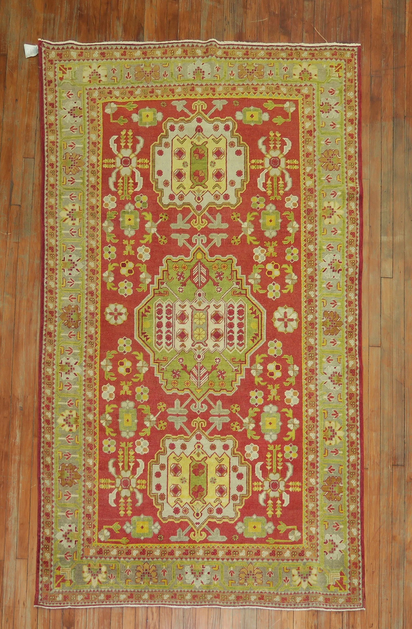5' 3" x 8' 4" Early 20th Century Khotan Rug Red Green Yellow: 5' 3" x 8' 4" Early 20th Century Khotan Rug Red Green Yellow Early 20th century Khotan Samarkand rug with a floral and geometric pattern in red, green, and yellow. Pre-owned. Specifications Title: Ant