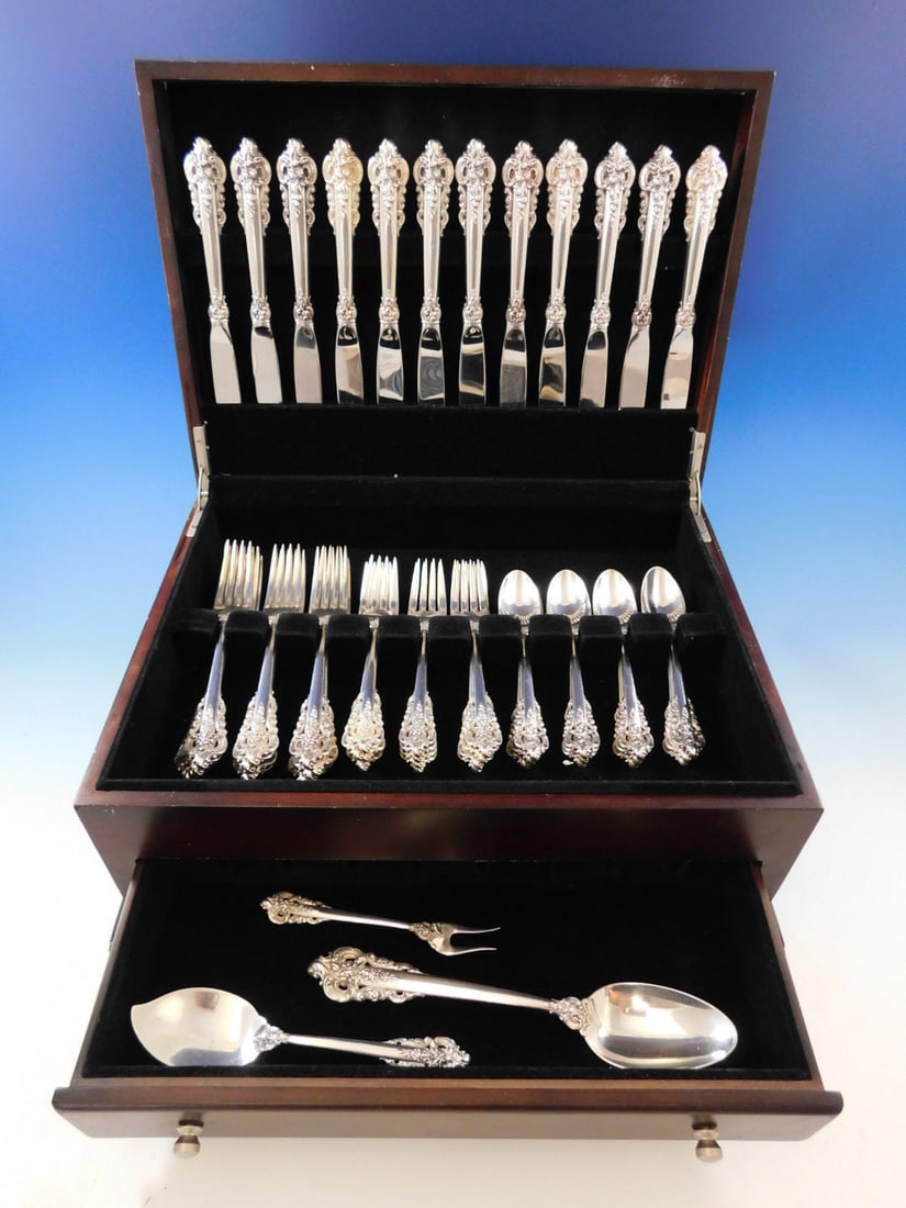 51 Piece Wallace Grande Baroque Sterling Silver Flatware Service for 12: 51 Piece Wallace Grande Baroque Sterling Silver Flatware Service for 12 This Wallace Grande Baroque sterling silver flatware set features the iconic baroque style introduced in 1941. The set includes 