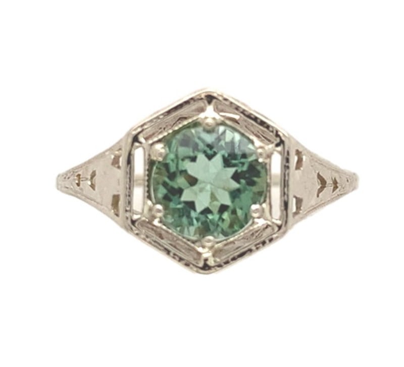 Art Deco 14k White Gold Filigree Ring with Green Tourmaline: Art Deco 14k White Gold Filigree Ring with Green Tourmaline This Art Deco ring features a genuine round brilliant cut green tourmaline, weighing approximately 0.97 carats and measuring about 5.9mm in 