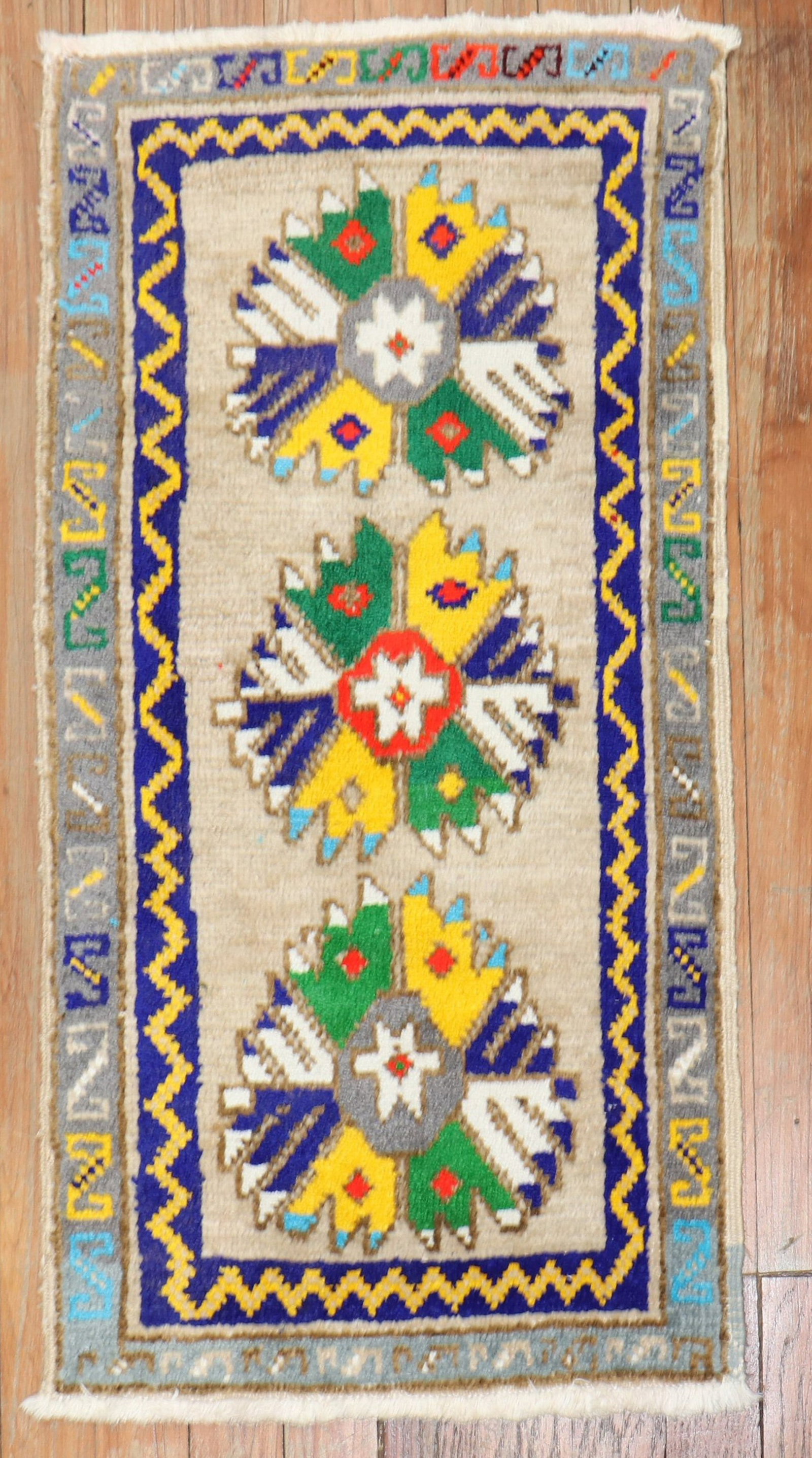 1' 5" x 2' 9" Turkish Anatolian mat rug: 1' 5" x 2' 9" Turkish Anatolian mat rug A pre-owned Turkish Anatolian mat rug with distinctive, quirky colors. This rectangular rug features a symmetrical floral design and is categorized as a yastik.