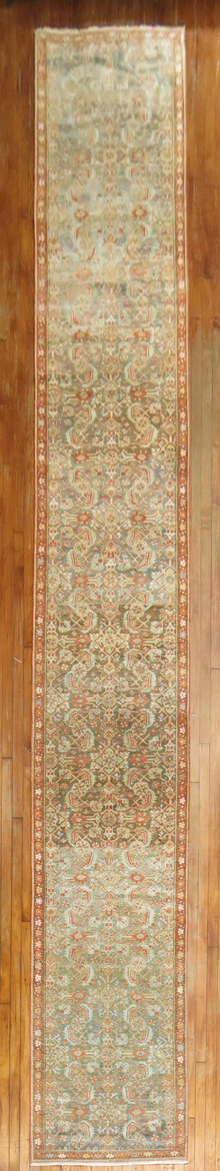 2' 10" x 21' 8" Persian Malayer rug runner circa 1920: 2' 10" x 21' 8" Persian Malayer rug runner circa 1920 Antique Persian Malayer runner, circa 1920, featuring an all-over herati design on a green abrashed field with predominant terracotta accents. Thi