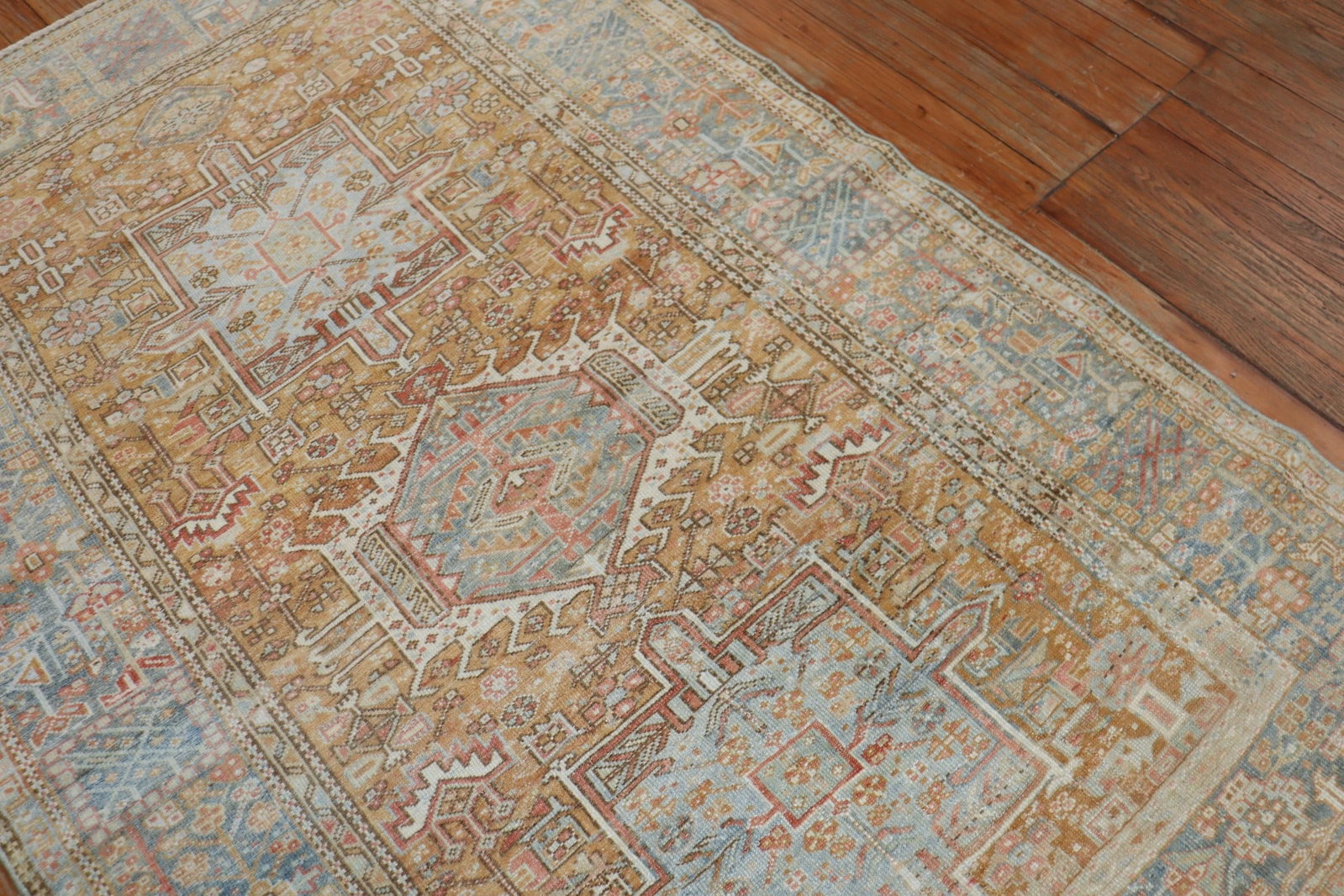 4' 2" x 6' 6" Persian Serapi Heriz Accent Rug: 4' 2" x 6' 6" Persian Serapi Heriz Accent Rug Early 20th century Persian Serapi/Heriz accent rug featuring an apricot field with a light blue border. Pre-owned. Specifications Origin: Persian Type: Se