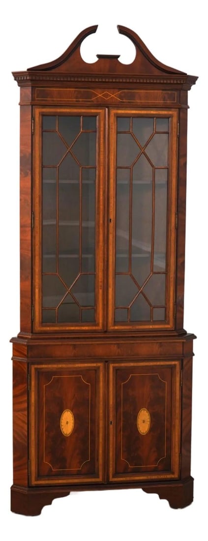 Mahogany corner display cabinet with inlay glass doors 33w x 19d x 83.5h: Mahogany corner display cabinet with inlay glass doors 33w x 19d x 83.5h English-made corner cabinet with mahogany construction, inlaid decoration, and fine carved details. This piece features adjusta