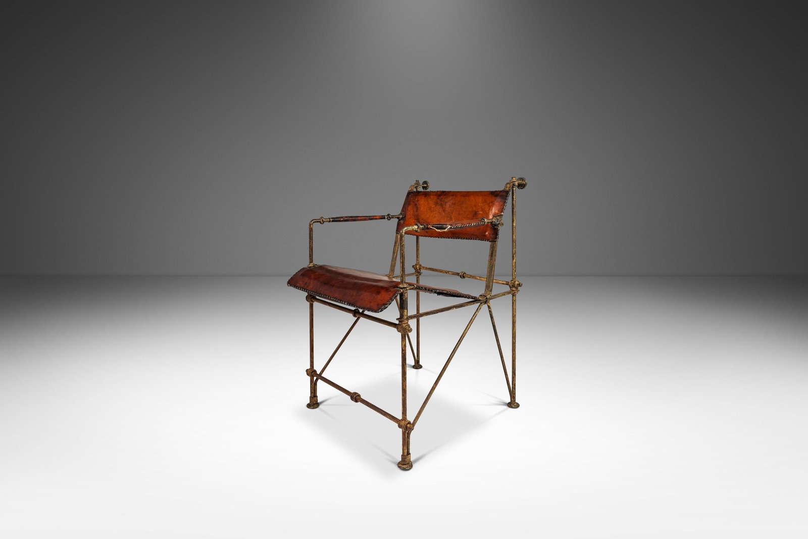 Vintage 1960s Ilana Goor Wrought Iron Leather Armchair: Vintage 1960s Ilana Goor Wrought Iron Leather Armchair This early armchair, attributed to renowned Israeli designer Ilana Goor, beautifully combines patinaed wrought iron with original leather in a di
