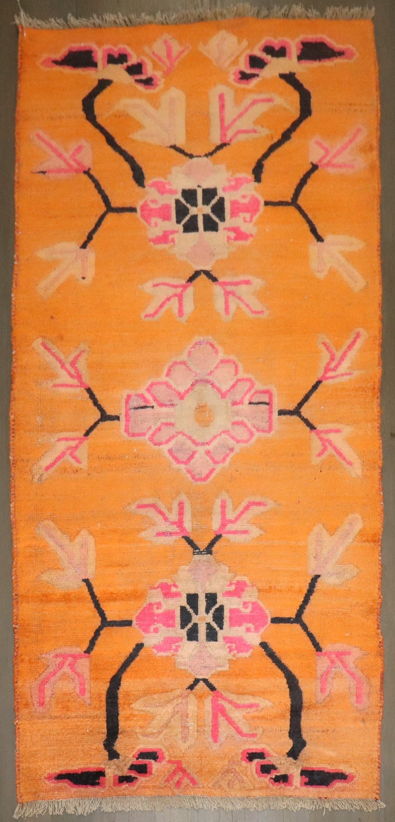 2' 9" x 5' 7" Vintage Tibetan Floral Rug in Bright Orange: 2' 9" x 5' 7" Vintage Tibetan Floral Rug in Bright Orange Mid-20th century Tibetan rug in a bright orange color with a floral design. This pre-owned small rug offers a distinctive vintage look. Specif