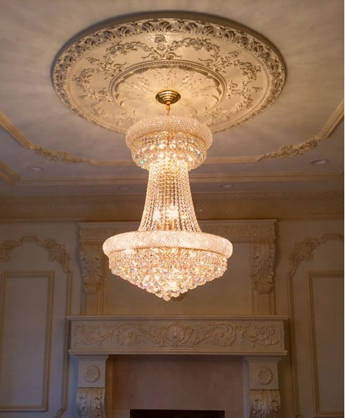 Artistry Primo 15 Light Gold Crystal Chandelier 32in: Artistry Primo 15 Light Gold Crystal Chandelier 32in Modern gold chandelier with an empire-style shade shape and Asfour crystals. It is a 15-light indoor fixture designed for hardwired installation, w