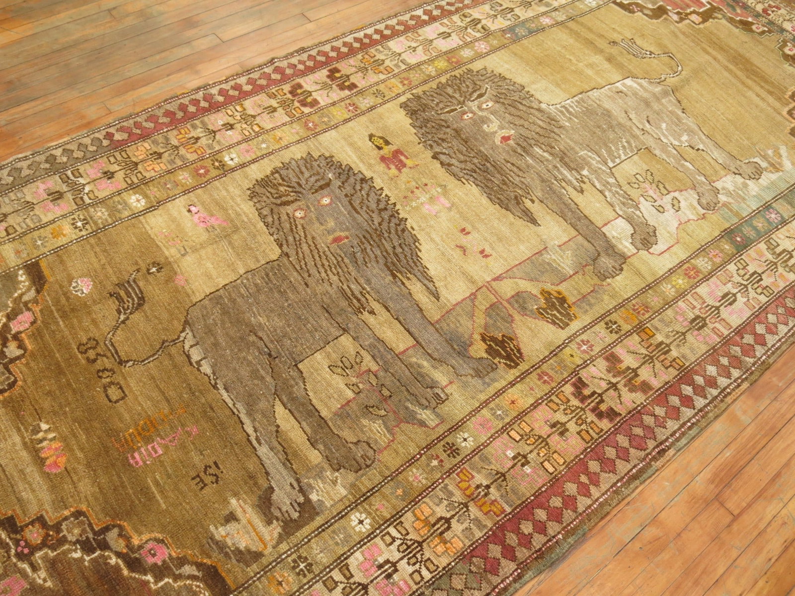 5' 7" x 11' 10" Turkish Anatolian pictorial gallery rug with lion pair: 5' 7" x 11' 10" Turkish Anatolian pictorial gallery rug with lion pair Early 20th century Turkish Anatolian pictorial gallery rug featuring a pair of lions with additional pictorial figures and human 