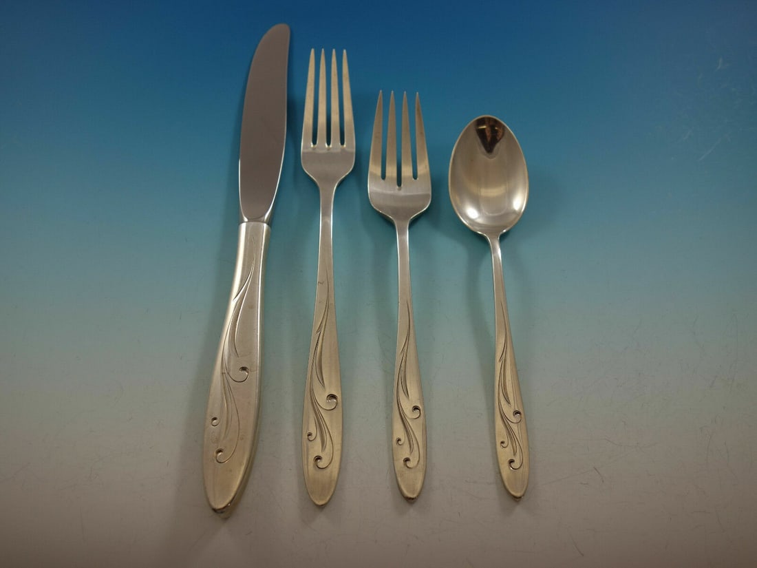 Towle Awakening Sterling Silver 4-Piece Place Setting: Towle Awakening Sterling Silver 4-Piece Place Setting This 4-piece place setting from the Awakening pattern by Towle features exquisite craftsmanship in sterling silver. The set includes a regular kni