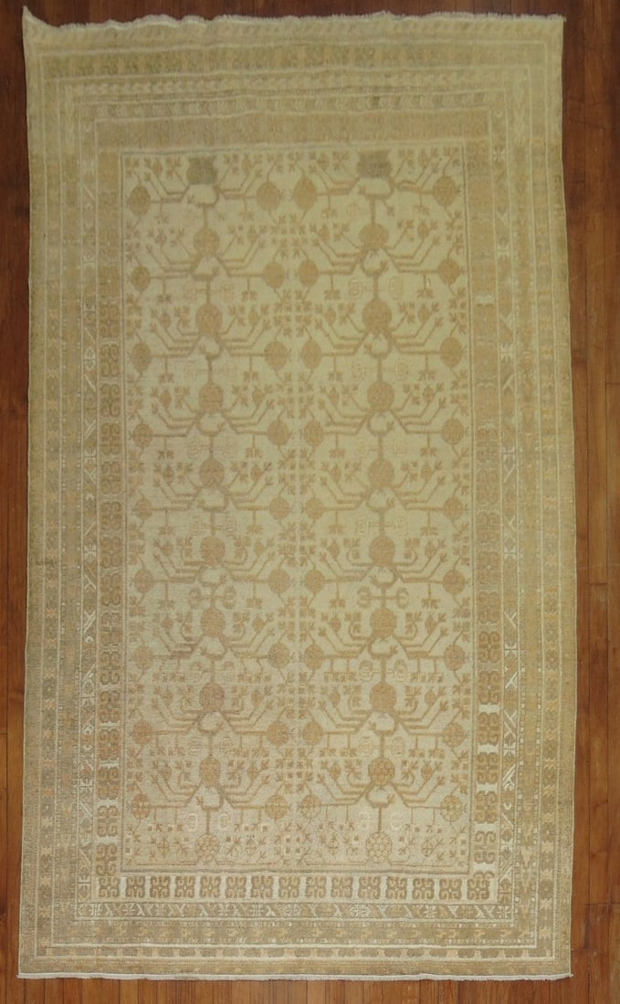 5' 7" x 10' 4" Early 20th Century Khotan Gallery Rug: 5' 7" x 10' 4" Early 20th Century Khotan Gallery Rug Early 20th century antique Khotan gallery rug with intricate floral and geometric patterning. This pre-owned piece reflects the traditional Khotan 