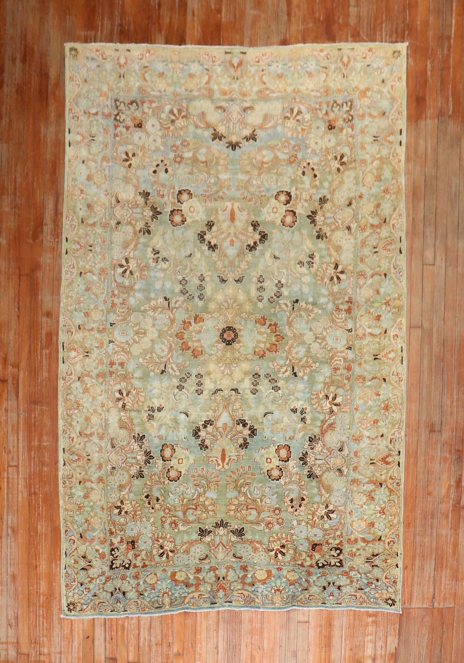 5' 9" x 9' 4" Persian Sarouk Rug in Light Blue Green: 5' 9" x 9' 4" Persian Sarouk Rug in Light Blue Green Early 20th century Persian Sarouk rug featuring a formal design in light blue, green, and terracotta. This pre-owned rug offers classic Persian sty