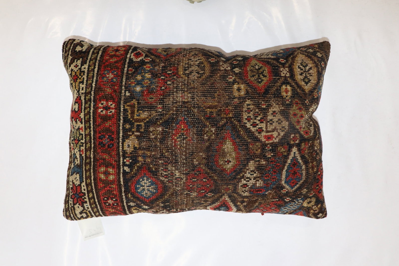1' 4" x 2' Persian Kurdish Rug Pillow Brown: 1' 4" x 2' Persian Kurdish Rug Pillow Brown Decorative pillow made from an early 20th century Persian Kurdish rug, featuring a rustic Kurd pictorial design. Pre-owned. Specifications Type: Kurd pictor
