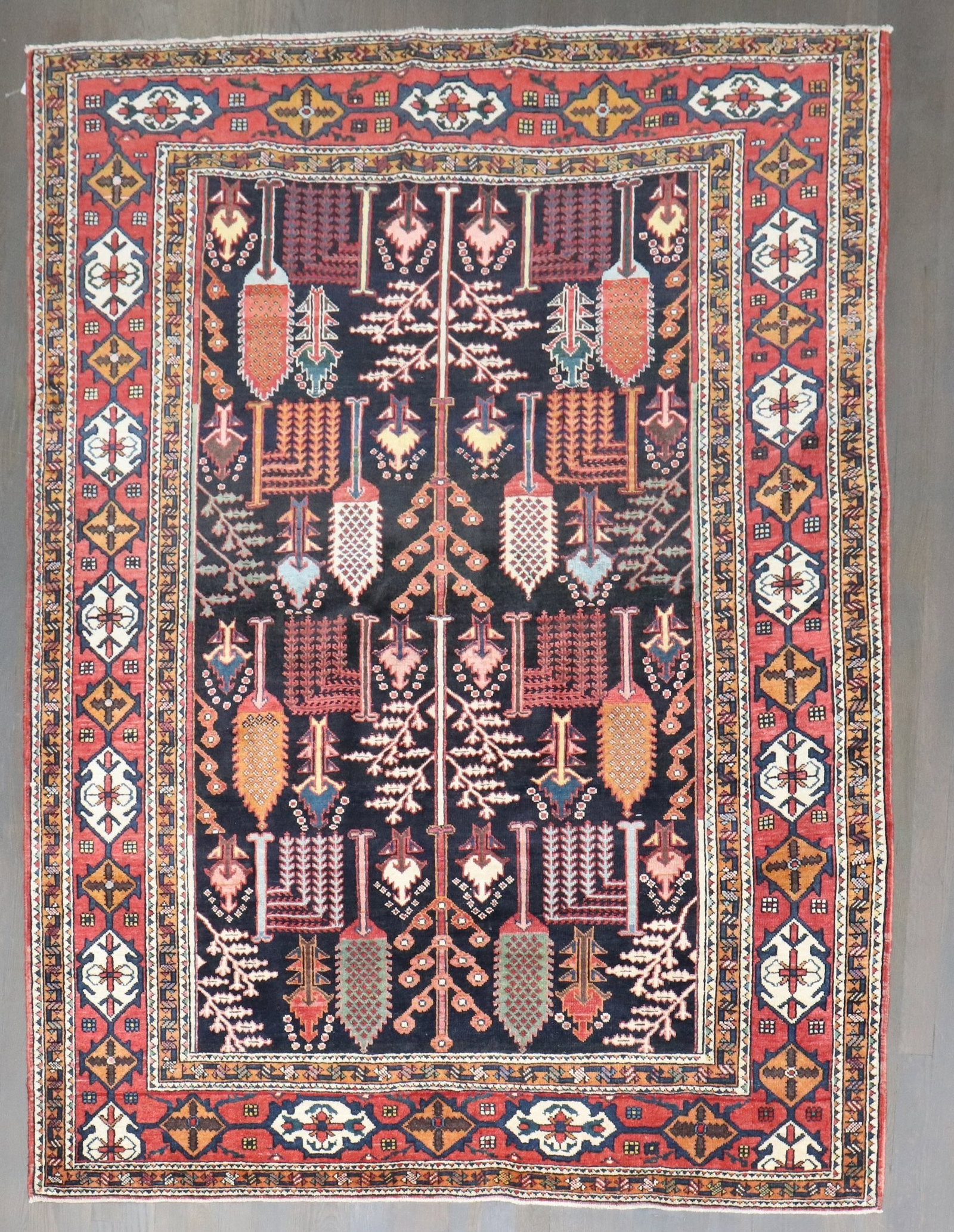 5' x 6' 6" Persian Bakhtiari Tree of Life Rug: 5' x 6' 6" Persian Bakhtiari Tree of Life Rug Persian Bakhtiari rug from the second quarter of the 20th century, featuring a Tree of Life design on a navy field. Pre-owned condition. Specifications Ty