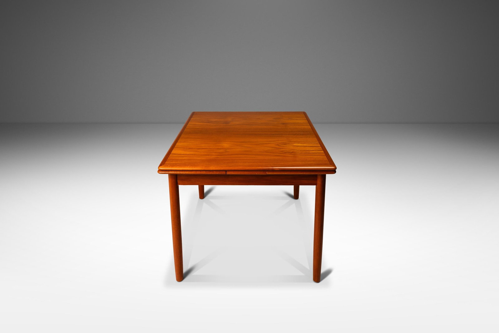 Danish Mid-Century Modern Teak Expansion Dining Table with Stow-in-Leaves 60": Danish Mid-Century Modern Teak Expansion Dining Table with Stow-in-Leaves 60" Discover this exquisite Danish Mid-Century Modern expansion dining table, crafted in Denmark circa the 1970s. Made from a 