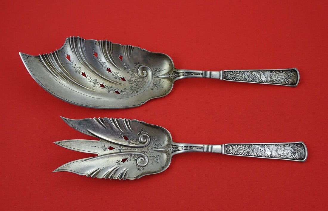 Wood and Hughes Celestial Sterling Silver Fish Serving Set 9 3/4 inches: Wood and Hughes Celestial Sterling Silver Fish Serving Set 9 3/4 inches Elevate your dining experience with this exquisite Celestial Fish Serving Set by Wood and Hughes. Crafted from sterling silver, 