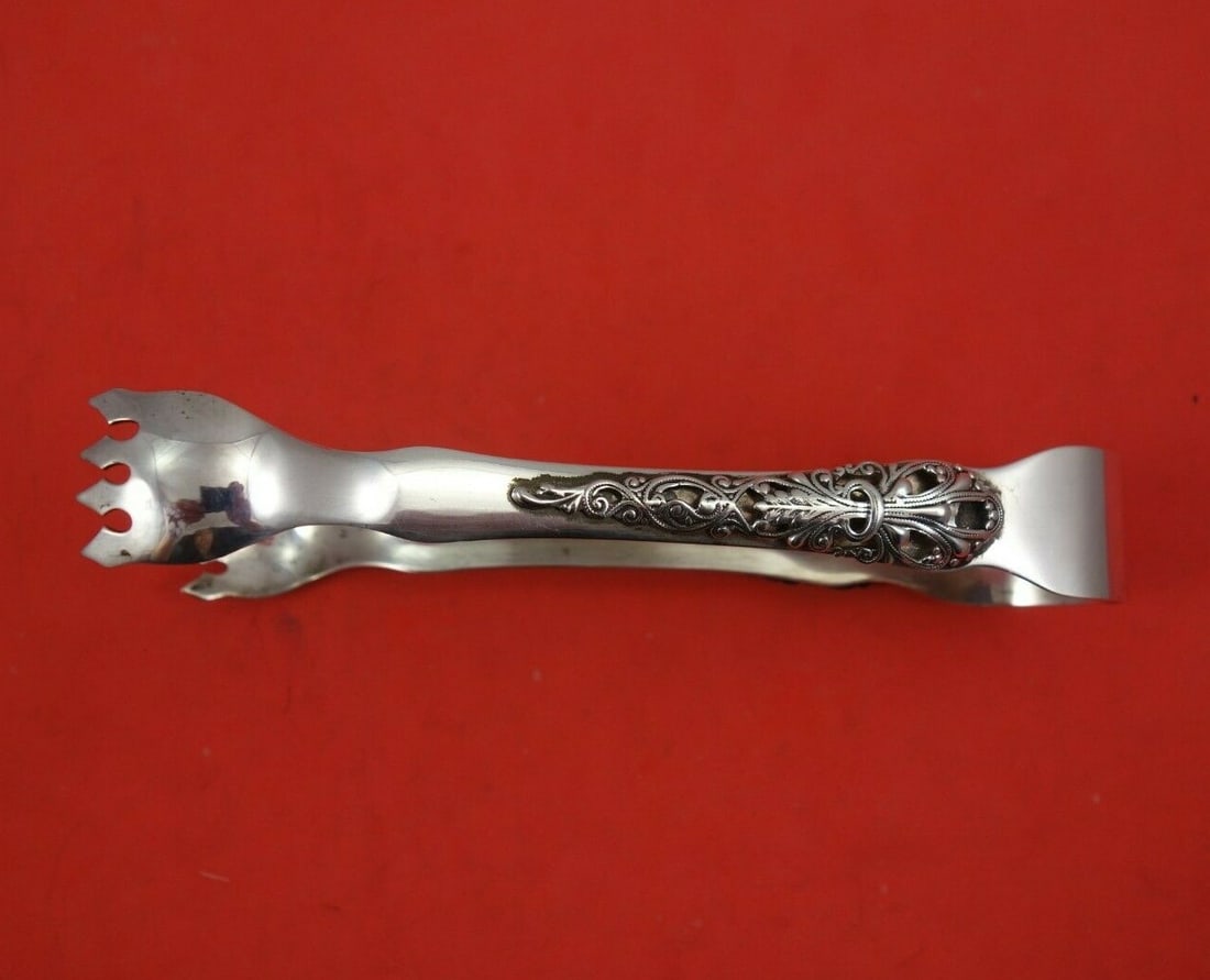 Aucello Sterling Silver Ice Tong 6.25 Inch Serving Piece: Aucello Sterling Silver Ice Tong 6.25 Inch Serving Piece This exquisite 6 1/4" ice tong by Aucello is crafted from high-quality sterling silver (.925), making it a perfect addition to your serving pie